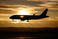 Aircraft landing sunset